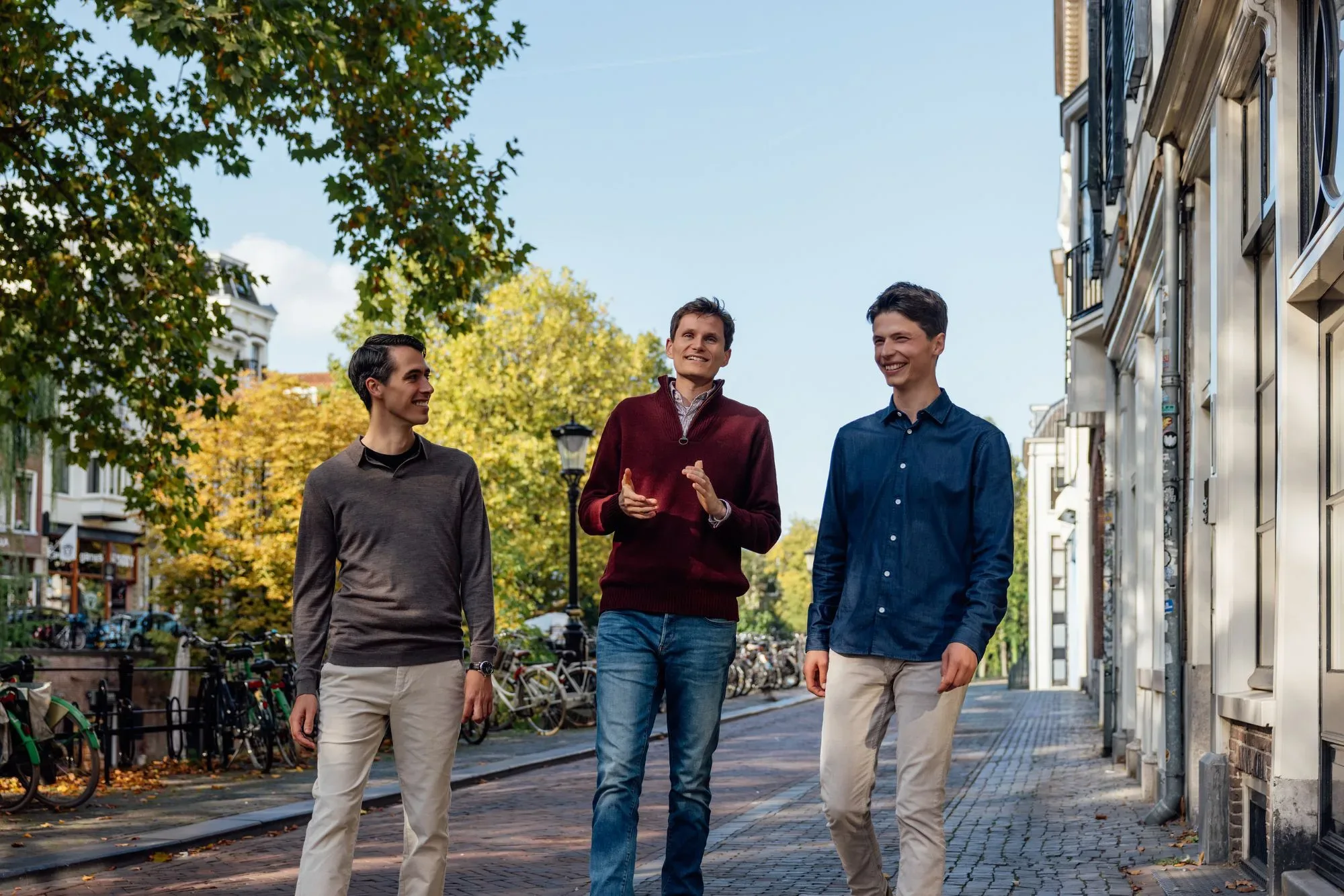 Three Nostrion team members walking along a canal in Utrecht