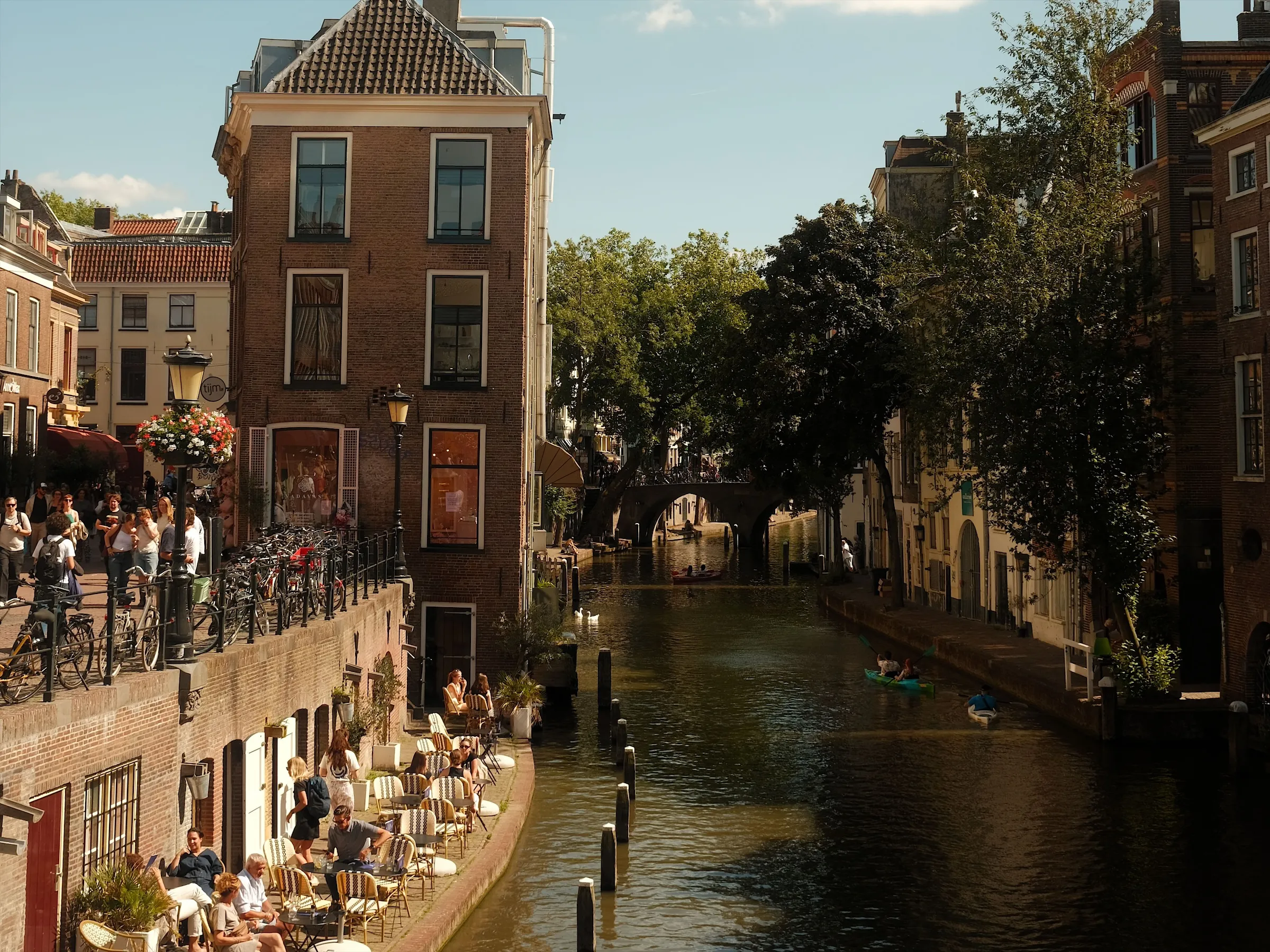 Café terraces along the Oudegracht canal in Utrecht on a sunny day